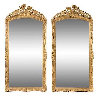 * A Pair of Rococo Style Giltwood Pier Mirrors Height 92 x width 44 1/2 inches.