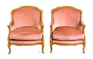 * A Pair of Louis XV Style Walnut Bergeres Height 32 1/2 inches.