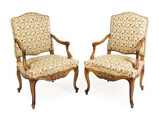* A Pair of Louis XV Style Walnut Fauteuils Height 40 1/2 x width 26 x depth 21 1/2 inches.