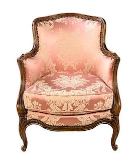 * A Louis XV Style Walnut Bergere Height 27 1/2 inches.