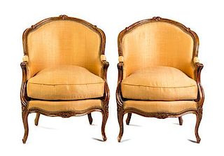 * A Pair of Louis XV Style Walnut Bergeres Height 34 inches.