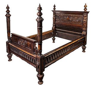 A Renaissance Revival Carved Walnut Bed Height of headboard 69 x width 68 1/4 inches.