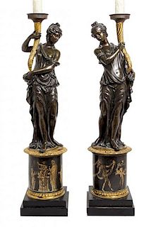 A Pair of Louis XVI Style Parcel Gilt Bronze Figures Height 47 1/4 inches overall.