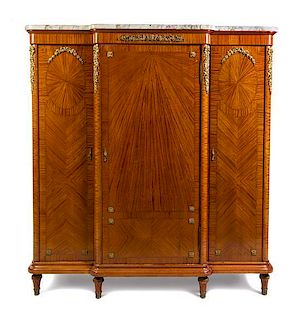 A Louis XVI Style Gilt Bronze Mounted Satinwood Armoire Height 71 1/4 x width 65 x depth 22 1/2 inches.