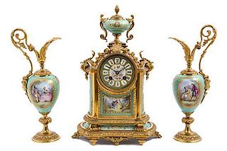 A French Gilt Bronze and Sevres Style Porcelain Clock Garniture Height of clock 14 3/4 inches.