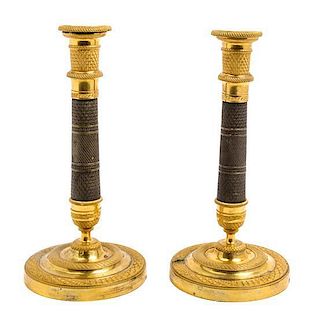 * A Pair of Empire Gilt and Patinated Bronze Candlesticks Height 10 3/4 inches.