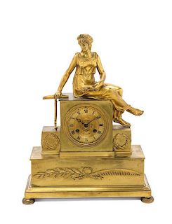 * An Empire Gilt Bronze Mantel Clock Height 15 1/2 inches.