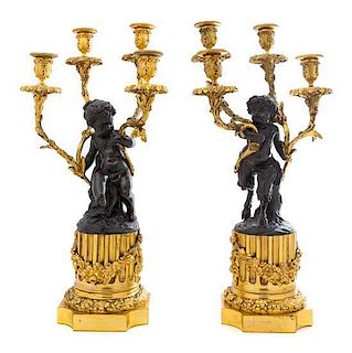 * A Pair of French Gilt and Patinated Bronze Four-Light Figural Candelabra Height 21 3/4 inches.