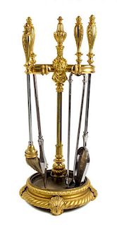 * A Set of Gilt Bronze Fireplace Tools on Stand Height of stand 34 1/4 inches.
