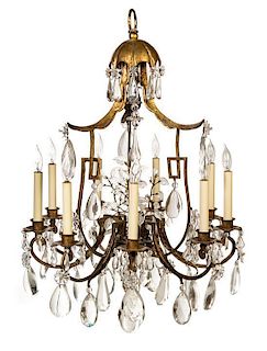 * A French Tole Nine-Light Chandelier Height 42 inches.