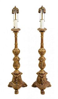 * A Pair of Italian Giltwood Prickets Height 47 inches.