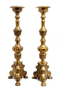 * A Pair of Brass Prickets Height 23 1/4 inches.
