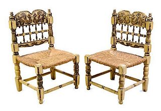 * A Pair of Spanish Colonial Polychrome Decorated Low Chairs Height 32 3/4 inches.