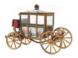 A Viennese Enameled Gilt Metal Musical Model of a Coach Height 7 1/4 inches.