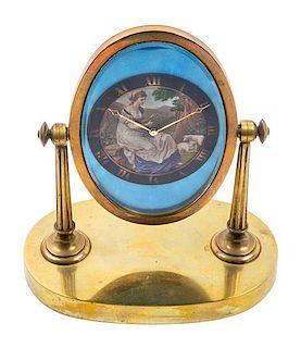 * A Swiss Brass Desk Clock Height 7 3/4 inches.