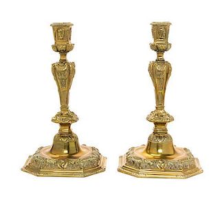 * A Pair of Neoclassical Style Brass Candlesticks Height 9 inches.