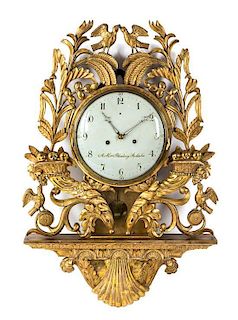 * A Swedish Giltwood Cartel Clock Height 35 inches.