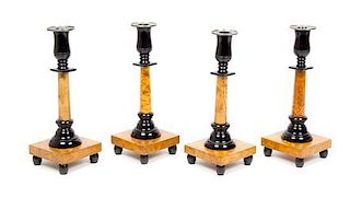 * A Set of Four Swedish Parcel Ebonized Burlwood Candlesticks Height 10 3/8 inches.
