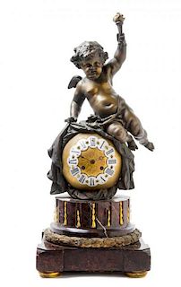 * A Continental Cast Metal and Marble Figural Clock Height 23 3/4 inches.