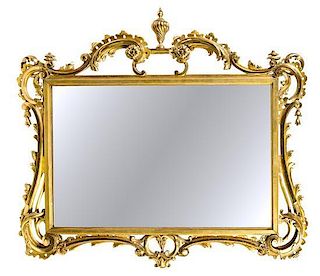 * A Neoclassical Style Giltwood Mirror Height 37 1/2 x width 42 inches.