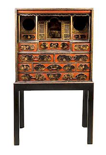 A Chinese Lacquered Collector's Cabinet Height 62 x width 11 x depth 33 3/4 inches.