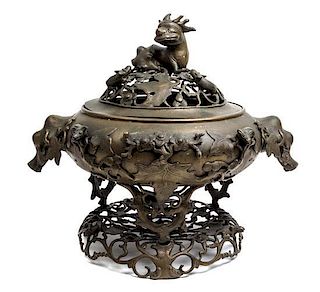 A Chinese Bronze Covered Censer Height 15 1/2 inches.