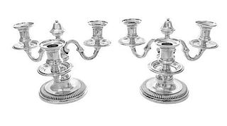* A Pair of French Silver Three-Light Candelabra, Emile Puiforcat, Paris, each having an undulating stem issuing scrolled can