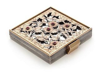 * A French Silver, Rose Gold and Ruby Compact, Boucheron, Paris, 1935, the pierced and engraved cover depicting flowers and s