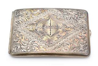 An American Silver Cigarette Case, , the case worked with foliate and geometric motifs throughout.