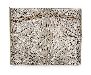 A Silver Filigree Cigarette Case, , the case centered with a flowerhead among foliate scrolls.