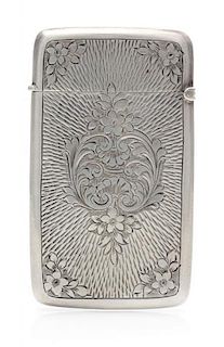 An Edwardian Silver Vesta Case, Maker's Mark Obscured, Birmingham, 1908, the case worked with S-scroll and floral elements an