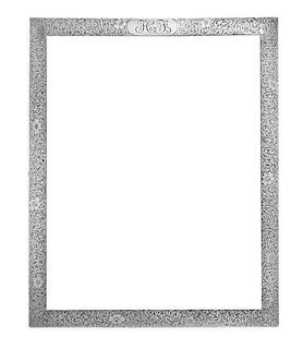 An American Silver Picture Frame, Tiffany & Co., New York, NY, having allover foliate volute and floral decoration, the top c