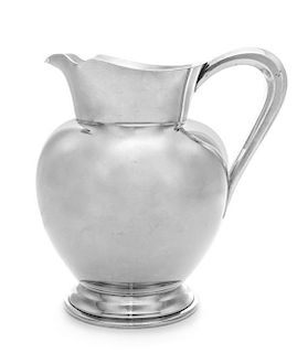 An American Silver Pitcher, Reed & Barton, Taunton, MA, 1950, having a paneled handle and a stepped foot.