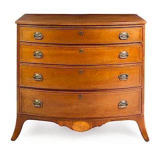 A Hepplewhite Cherry Chest of Drawers Height 36 x width 39 1/2 x depth 21 1/4 inches.
