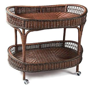 A Stained Wicker Tea Cart Height 31 x width 36 x depth 22 1/2 inches.