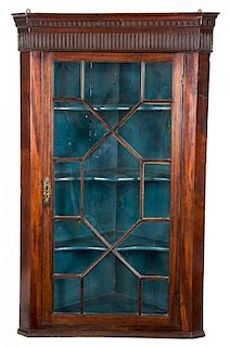 A George III Style Mahogany Hanging Corner Cabinet Height 47 x width 29 x depth 14 1/2 inches.