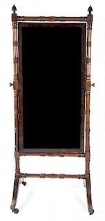 A Victorian Mahogany Cheval Mirror Height 66 x width 28 1/2 x depth 22 1/2 inches.