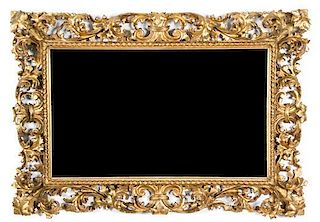A Carved Giltwood Mirror Height 43 1/2 x width 30 1/2 inches.