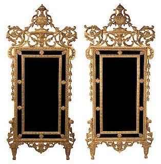 A Pair of Louis XVI Style Carved Giltwood Mirrors Height 68 x width 31 inches.