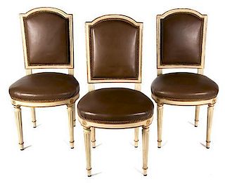A Set of Eight Louis XVI Style Carved and Painted Side Chairs Height 38 inches.