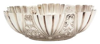 A Victorian Silver Bowl, Atkin Brothers, London, 1889, with fluted sides chased with foliate scrolls.