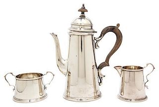 An American Silver Coffee Service, Redlich & Co., New York, NY, the coffee pot of lighthouse form with treen handle and finia