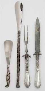 A Group of Four Sterling Handled Articles, , comprising a Gorham carving knife and fork, together with two shoe horns.