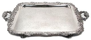 An English Silver-Plate Handled Tray, , having C-scroll handles, with grapevine border centered with a monogram, raised on fe