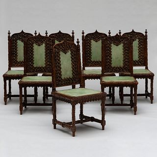 Set of Seven Gothic Revival Carved Oak and Leather Dining Chairs, Possibly French