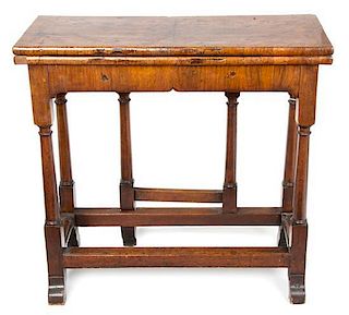 A George III Walnut Games Table Height 29 x width 30 x depth 12 3/4 inches.