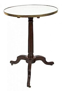 A George IV Mahogany Tilt Top Table Height 30 x diameter 21 3/4 inches.