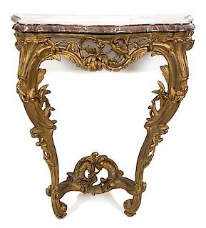 A French Carved and Gilt Console Table Height 34 1/2 x width 31 x depth 19 1/4 inches.