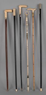 Four ivory and bone handle canes, together with aa