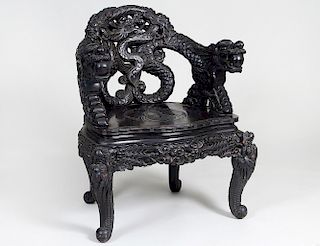 CHINESE CARVED EBONIZED WOOD DRAGON ARMCHAIR